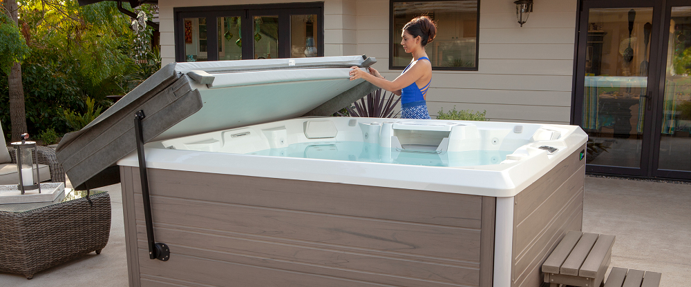 Brown-Haired Woman Using Hot Tub Cover Lifter