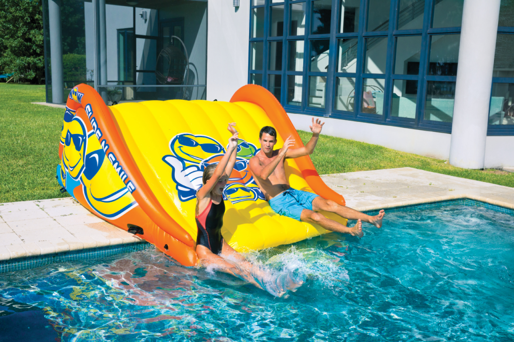 Two Kids having fun with Inflatable Wow Sports Pool Party Slide